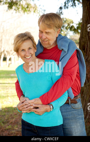 A couple in their 60"s together, holding each other. Stock Photo