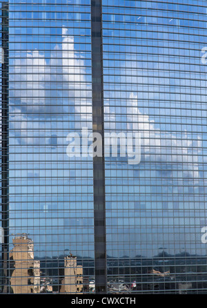 A cloud reflected on a modern steel and glass building in Houston, Texas Stock Photo