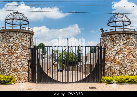 Gated Development - High walls and electric fences surround luxury homes in Johannesburg Stock Photo