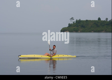 Tourist canoeing on Lake Kivu, Karongi, Rwanda Stock Photo