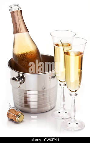 Two champagne glass with bottle on a white background. Stock Photo