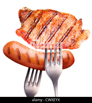 Sausage and steak on a fork. On a white background. File contains the path to cut. Stock Photo