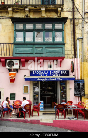 people sitting outdoor at an Snack Bar in Rabat , Malta Stock Photo