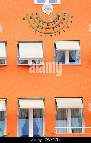 A sun clock on the house facade, small city Saarburg, Rheinland-Pfalz, Germany, evening, summer Stock Photo
