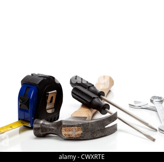 A hammer, screwdrivers, wrenches and a tape measure on a white background with copy space Stock Photo