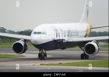 A Monarch Airlines Boeing 757 taxiing on the runway of Manchester International Airport (Editorial use only) Stock Photo