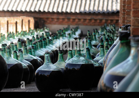 old wine obtained by oxidative aging process exposing wine in large bottles of glass Cooperative Winery Falset - Marça Priorat Stock Photo