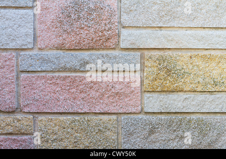 Decorative stone cladding on house wall Stock Photo