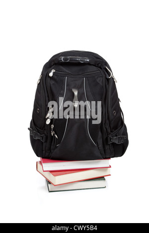 A black backpack on a stack of school books Stock Photo