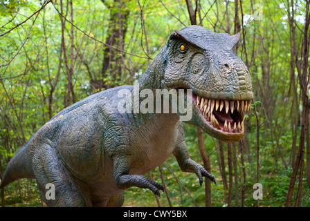 Tyrannosaurus - Dinosaur in the dark forest Stock Photo