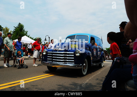 Vintage auto races to finish line in The Great Race. Stock Photo