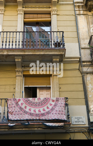 Apartment building with wrought iron balconies & washing drying Barcelona Catalonia Spain ES Stock Photo