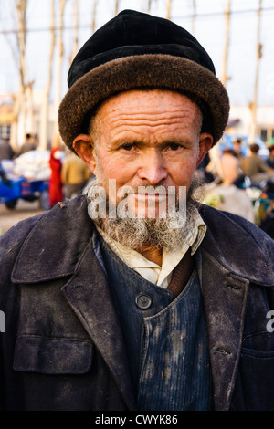 portrait of Uyghur man in Kashgar Sunday market , Xinjiang , China Stock Photo