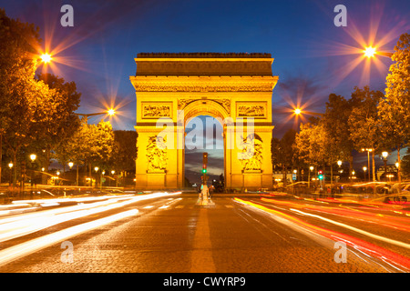 arc du triomphe and Champs Elysees traffic light trails at night Paris France EU Europe Stock Photo
