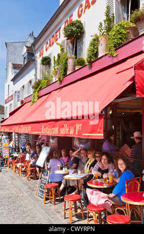 People sitting at a pavement cafe in the Place du Tertre Montmartre Paris France EU Europe Stock Photo