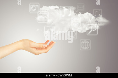 Hand, cloud and multimedia icons. Cloud computing concept - world wide data sharing and communication Stock Photo