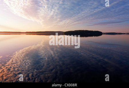 Colorful sunrise. Early morning on the Saimaa lake in Karelia, Finland Stock Photo