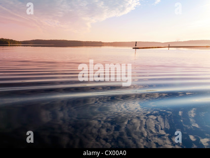 Colorful sunrise. Early morning on the Saimaa lake in Karelia, Finland Stock Photo