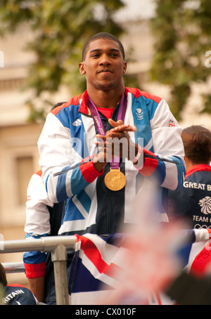 Antony Joshua applaudes  the crowd during the victory parade through the capital. London 2012 Team GB Stock Photo