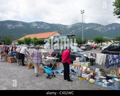 A brocante or flea market in Quillan, Aude, France with the Pyrenees in the background. Stock Photo