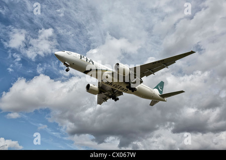 A Boeing 777 of PIA - Pakistan International Airways on final approach Stock Photo