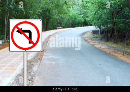 don't turn left sign with a right curved road background Stock Photo