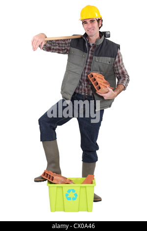 Construction worker promoting recycling Stock Photo