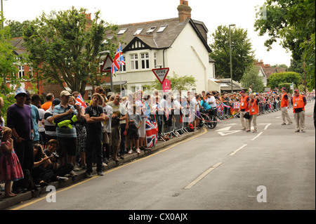 Crowds line the streets to watch the men's cycling time trials in Surrey, Great Britain Stock Photo