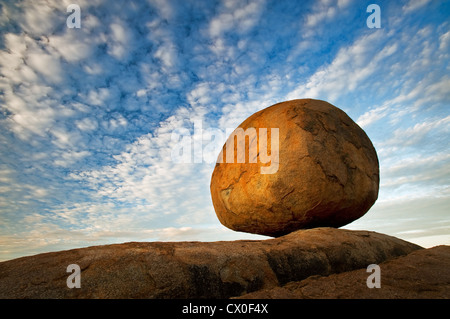 A granite boulder of the Devils Marbles glowing in the evening light. Stock Photo