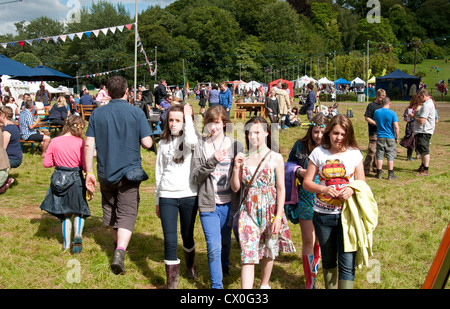 Teenagers walking round the Port Eliot literary festival St Germans Cornwall UK Stock Photo