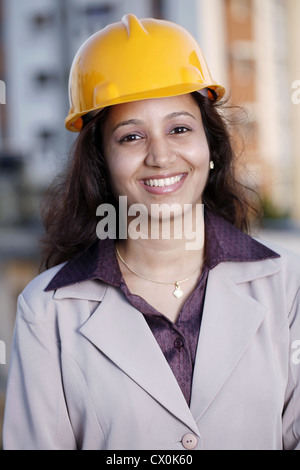 Smiling young female construction engineer Stock Photo