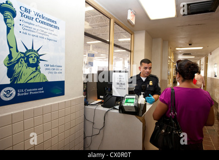 US Customs and Border Protection officers attend to ask for documentation and immigration status to people coming into the US Stock Photo