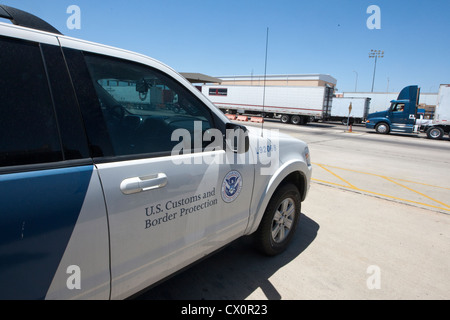 Long line of trucks waiting to enter the US from Mexico at the World Trade International bridge in Laredo Texas Stock Photo
