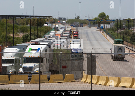 Long line of trucks waiting to enter the US from Mexico at the World Trade International bridge in Laredo Texas Stock Photo