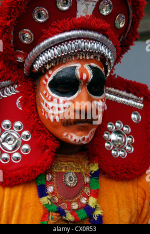 Folk artist in full makeup for Onam festival celebration performance in road procession at Trivandrum city of Kerala,India Stock Photo