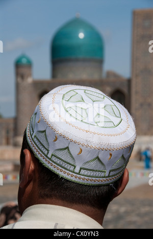 Local man wearing a Muslim hat in the Ragistan Square of Samarkand, Uzbekistan Stock Photo