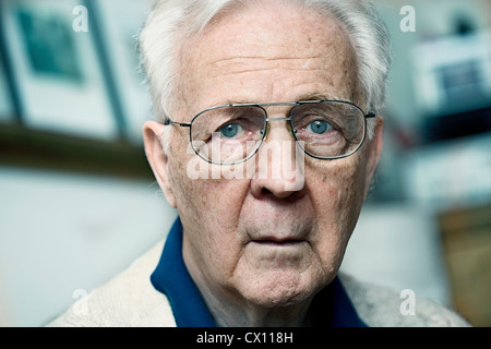 Close up portrait of a senior man looking confused Stock Photo