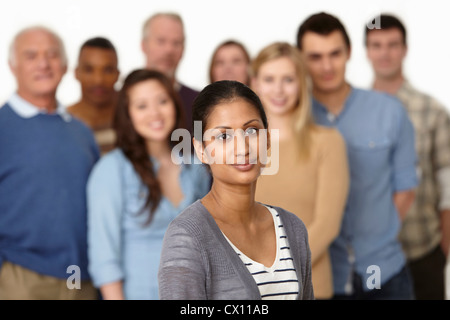 Portrait of woman with group of people in background Stock Photo