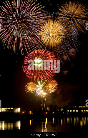 Firework display over water Stock Photo