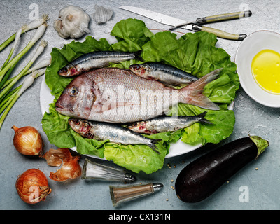 Raw fish and vegetables Stock Photo