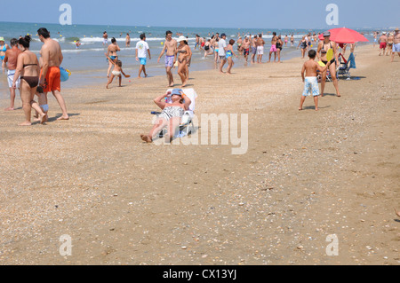 Woman Sunbathing Nude On Sandy La Digue Island Shore Washed By Waves