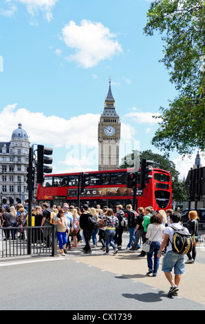 London, England - June 30th, 2012: Tourists crossing road in front of Big Ben in Bridge Street London England. Stock Photo