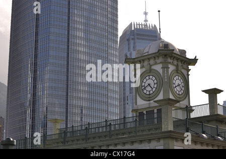 Clock tower and One / Two International Finance Center in the background (Hong Kong, China) Stock Photo