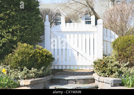 A garden gate in a residential spring garden. Stock Photo