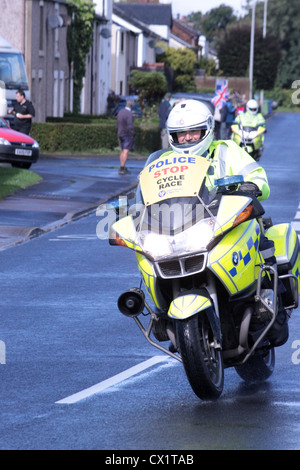 Police outrider on motorbike ahead of the Tour of Britain cycle race stage 4 Carlisle to Blackpool on 12th September 2012 Stock Photo