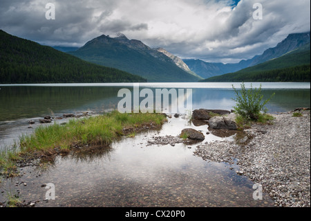 Clouds reflected in the water of Bowman Lake in Glacier National Park, Montana. Stock Photo