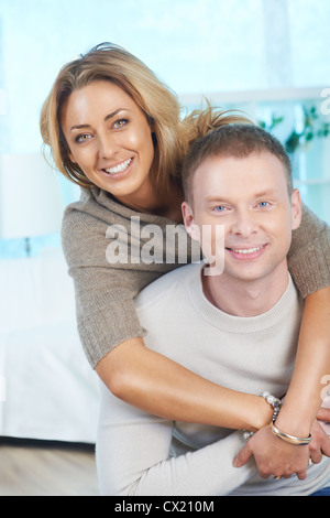 Happy couple looking at camera with smiles Stock Photo