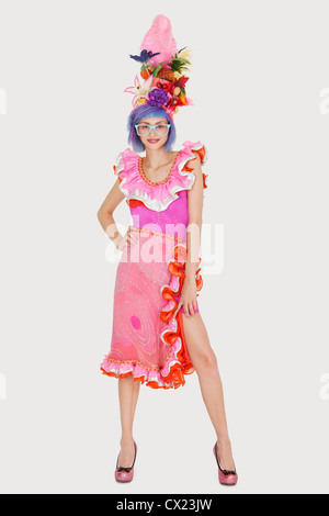 Portrait of beautiful young woman in Brazilian outfit over gray background Stock Photo