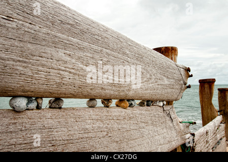 weathered old wooden breakwater groynes sea defence Stock Photo