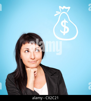 Beautiful young woman think about money on blue background Stock Photo